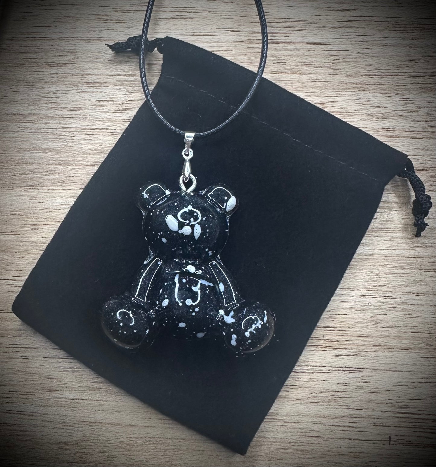 The Obsidian Fleck Resin Bear Cling Buddy Cord Necklace